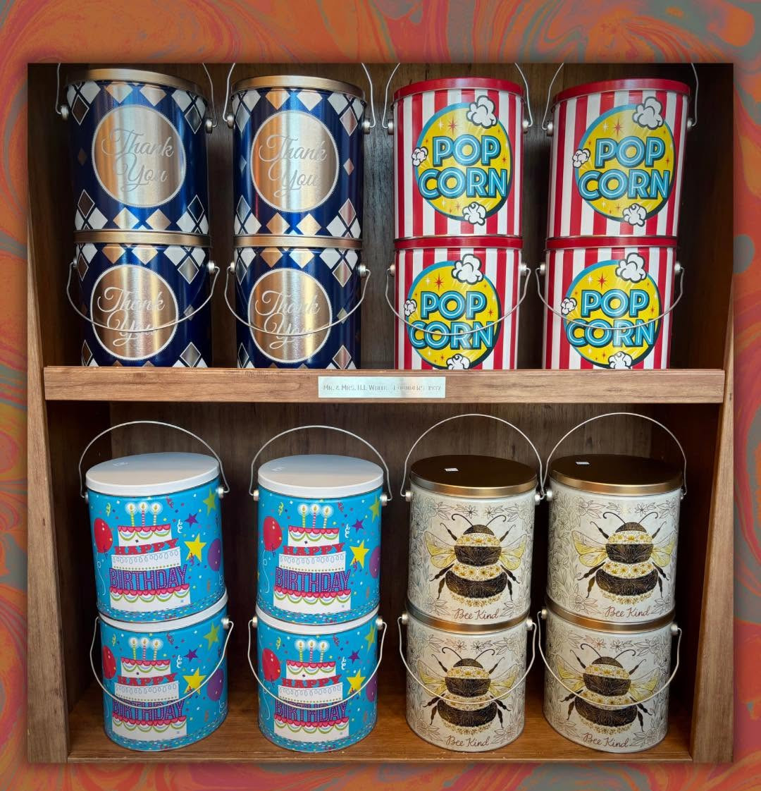 Colorful Velvet Creme popcorn tins on display