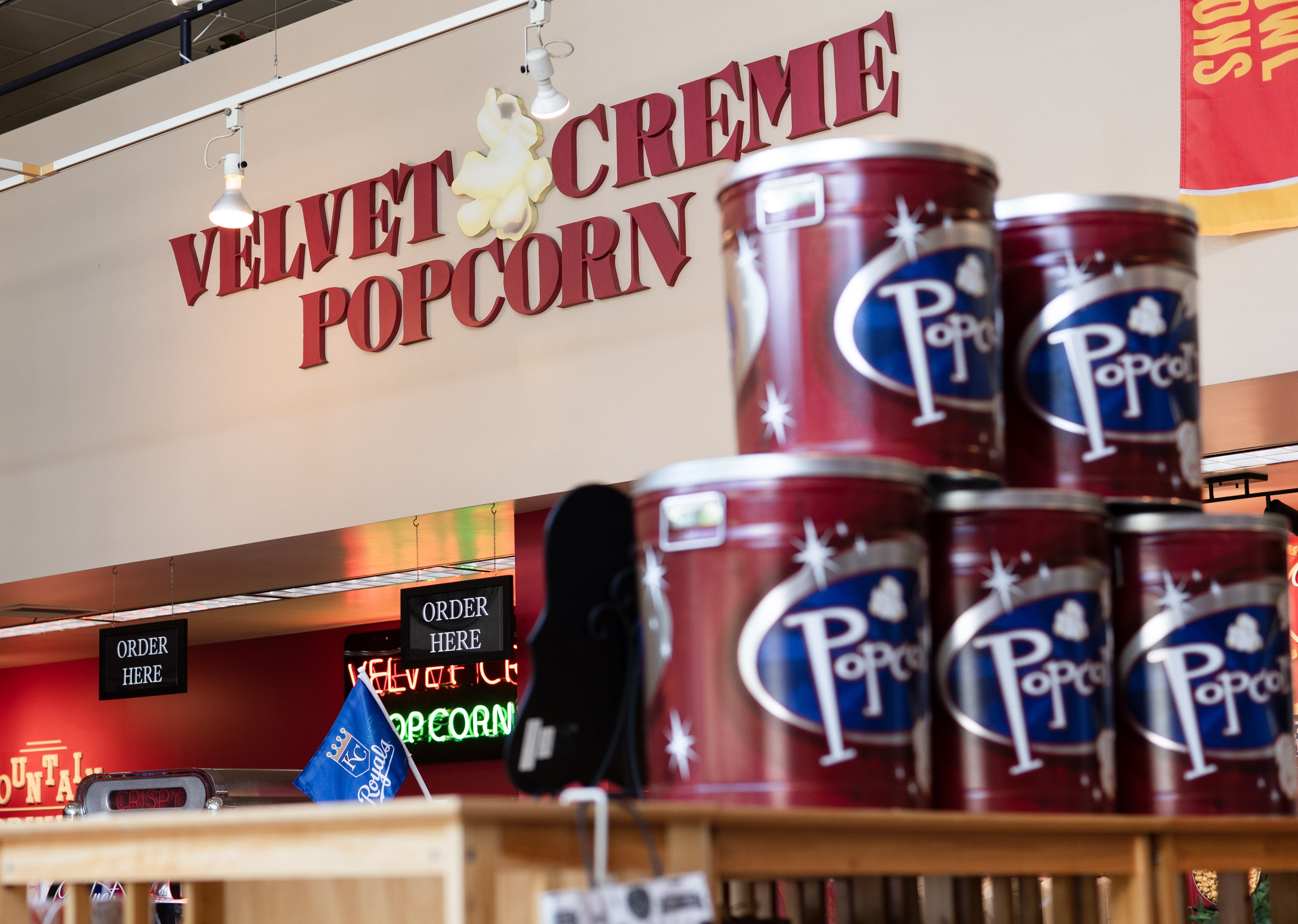 Velvet Creme retail display with popcorn cans and store signage
